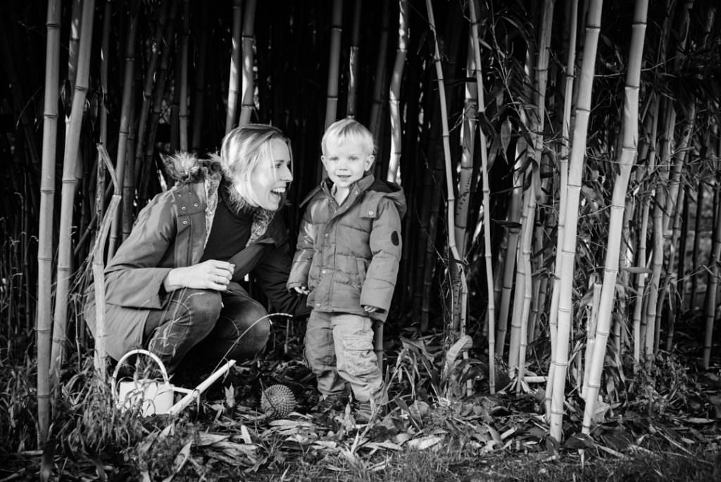 mother and son laugh during their family photography session in hertfordshire