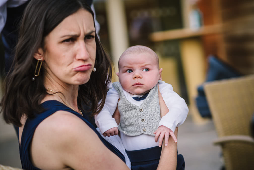 funny capture of baby and his mum making faces
