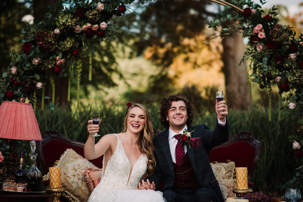 bride and groom toast their wedding guests