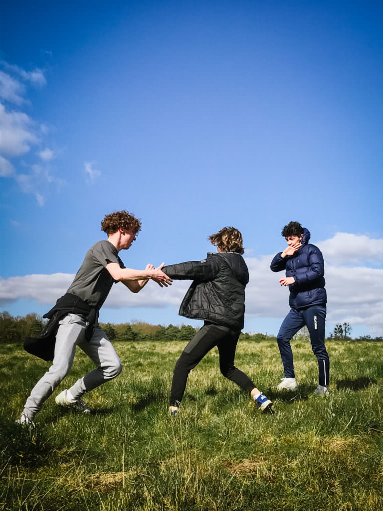 Three siblings walking captured by hertfordshire photographer