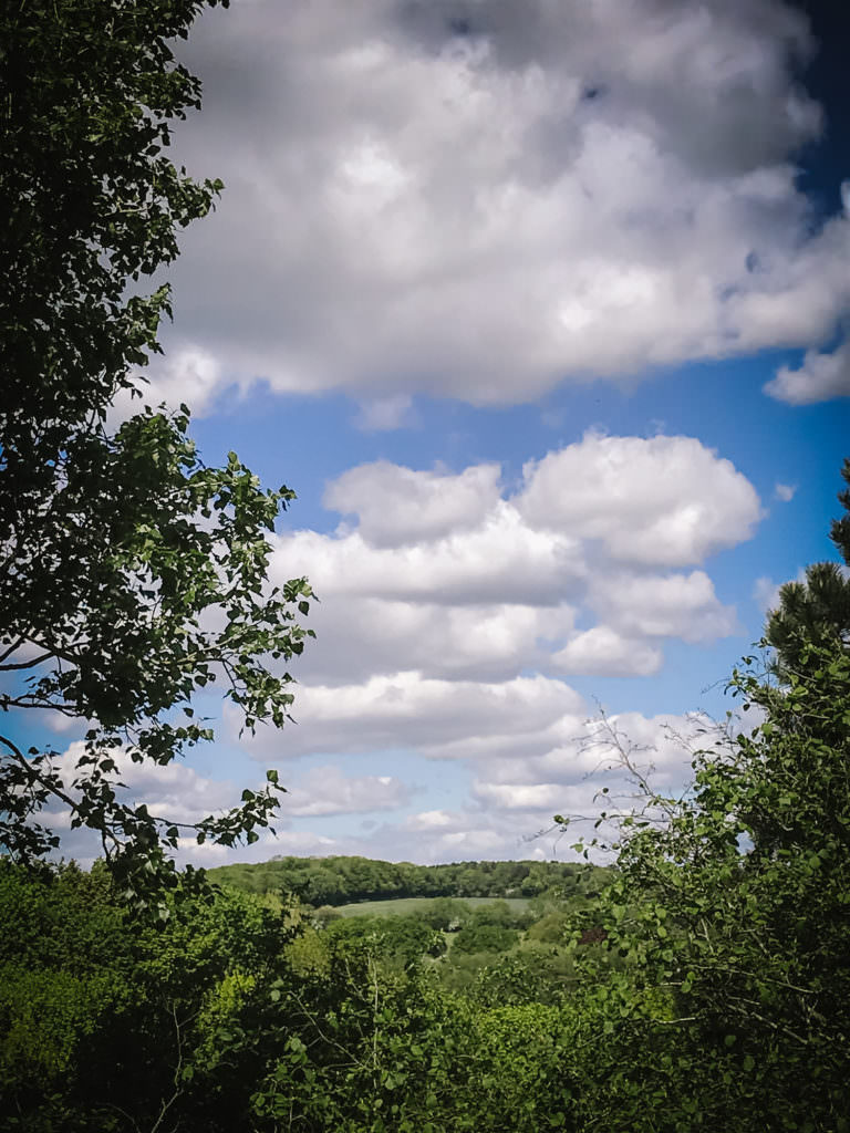 photography across fluffy clouds and hertfordshire fields whilst walking