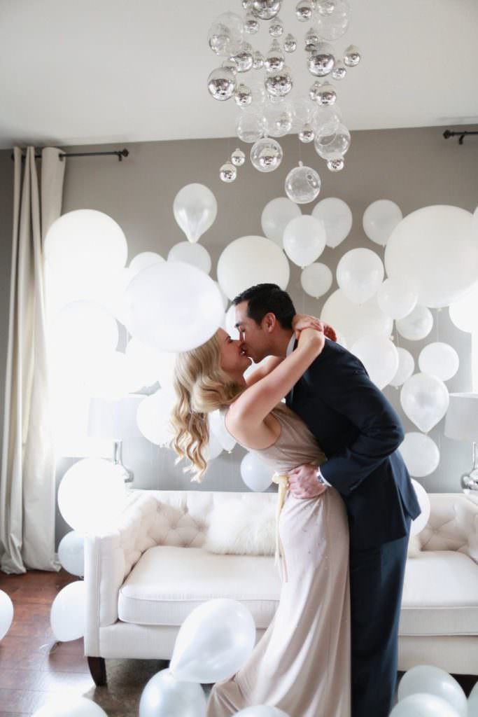 Plan a wedding proposal at home using balloons to decorate
