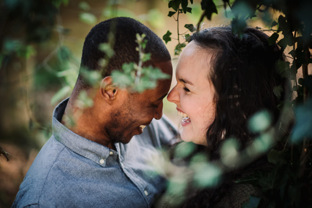 Portrait of a laughing young couple in the woods