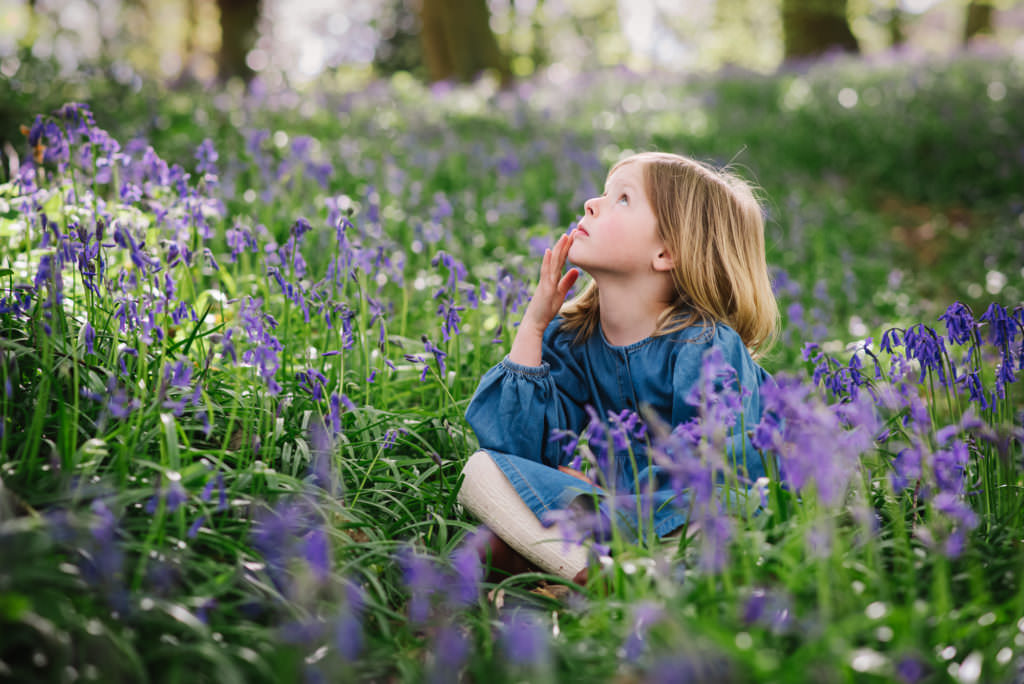 child photographer in welwyn garden city captures portrait of young girl in the bluebells