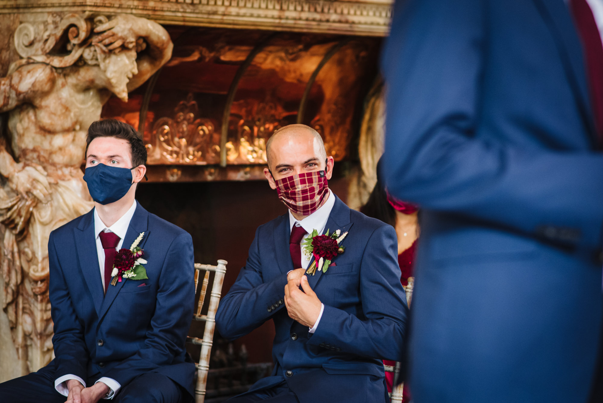 Masked guest peeps over at London wedding photographer