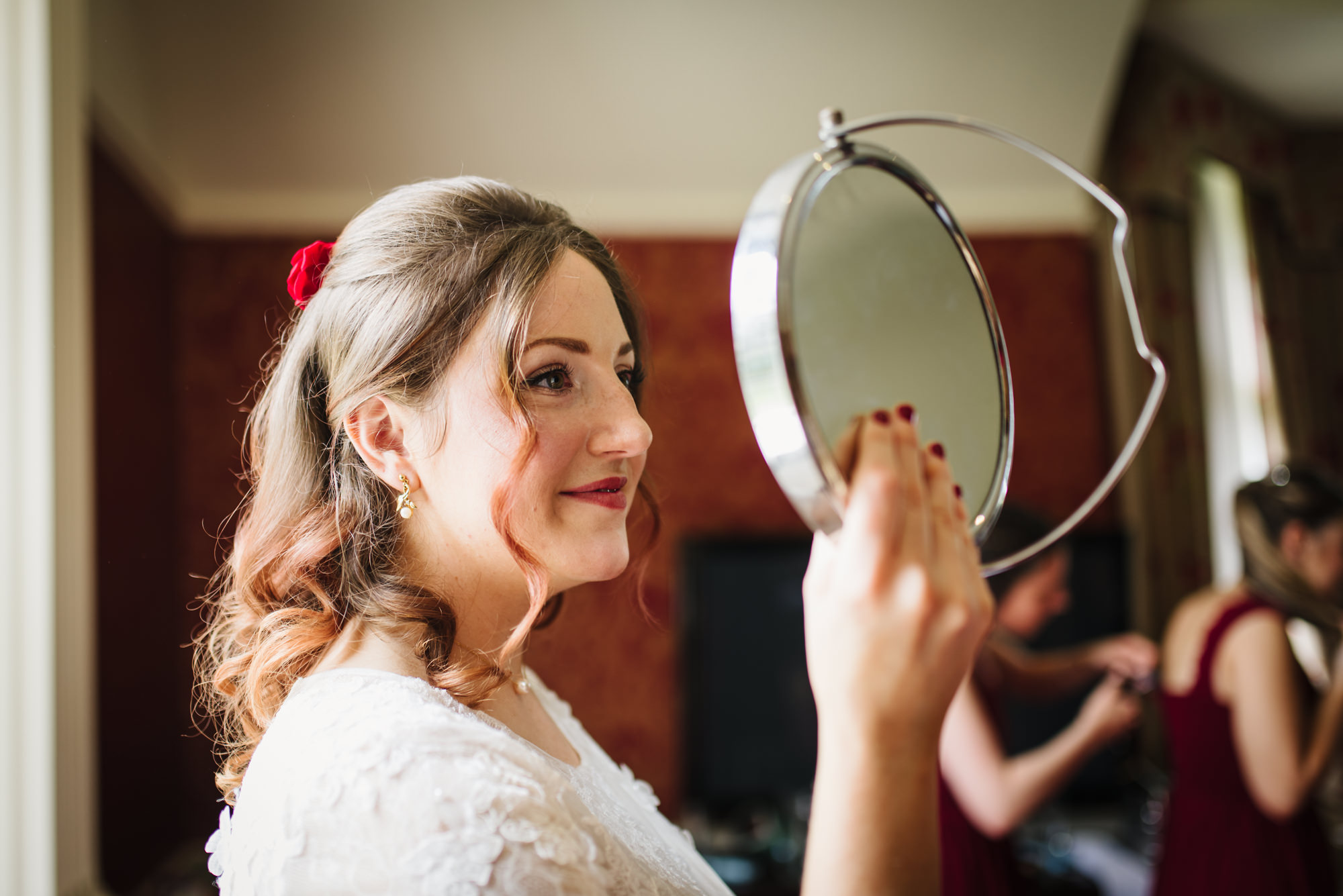 London weding photographer captures bride looking at herself in the mirror