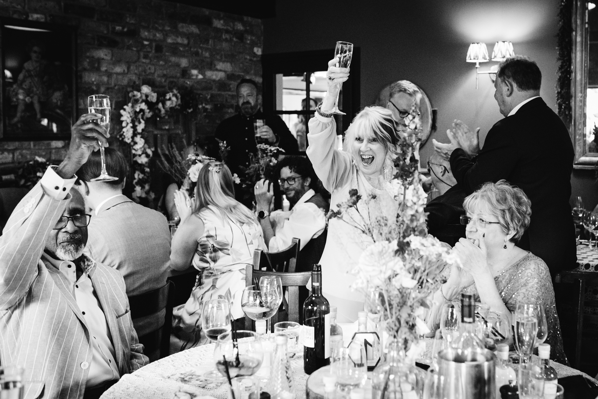 Pub wedding photographer snaps guests enjoying the wedding speeches