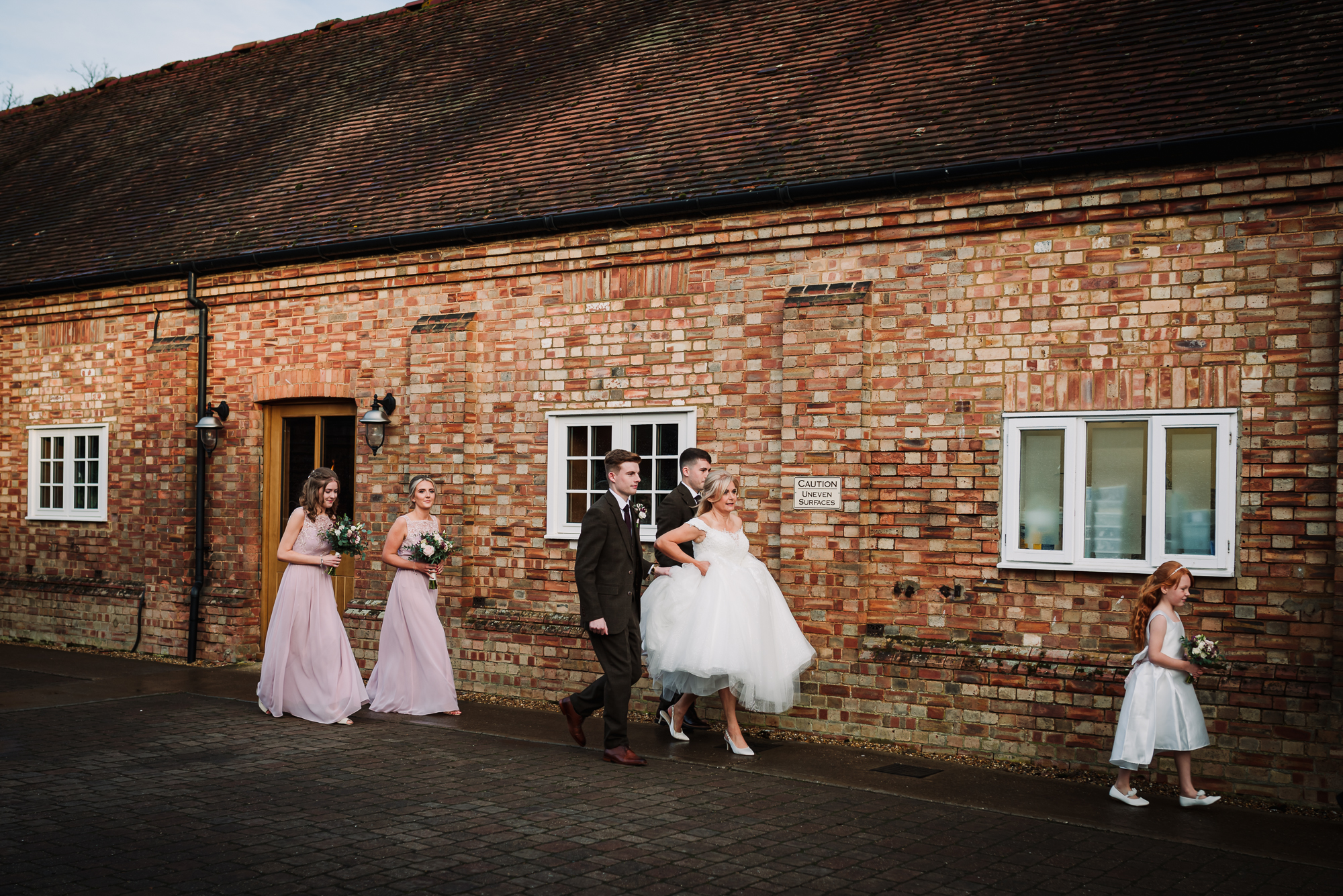bridal party making their way to the wedding at tewin bury farm hotel