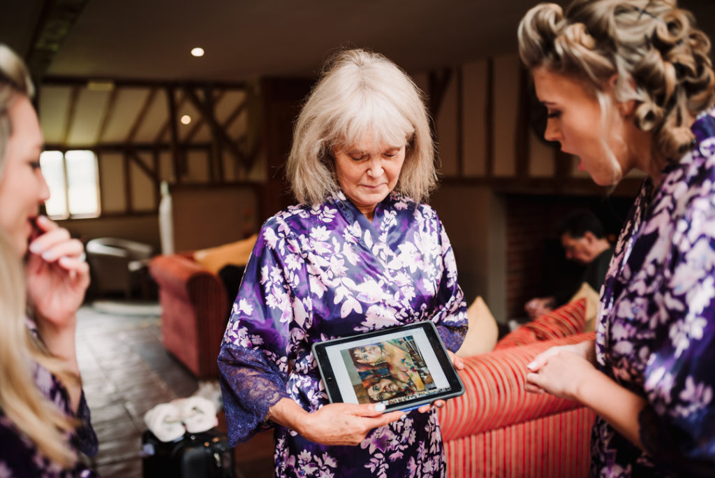 mother of the bride chats to the bridesmaids at coltsfoot country  retreat wedding
