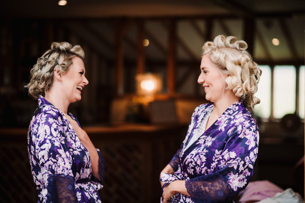 bridesmaid laugh together during bridal prep at coltsfoot country retreat