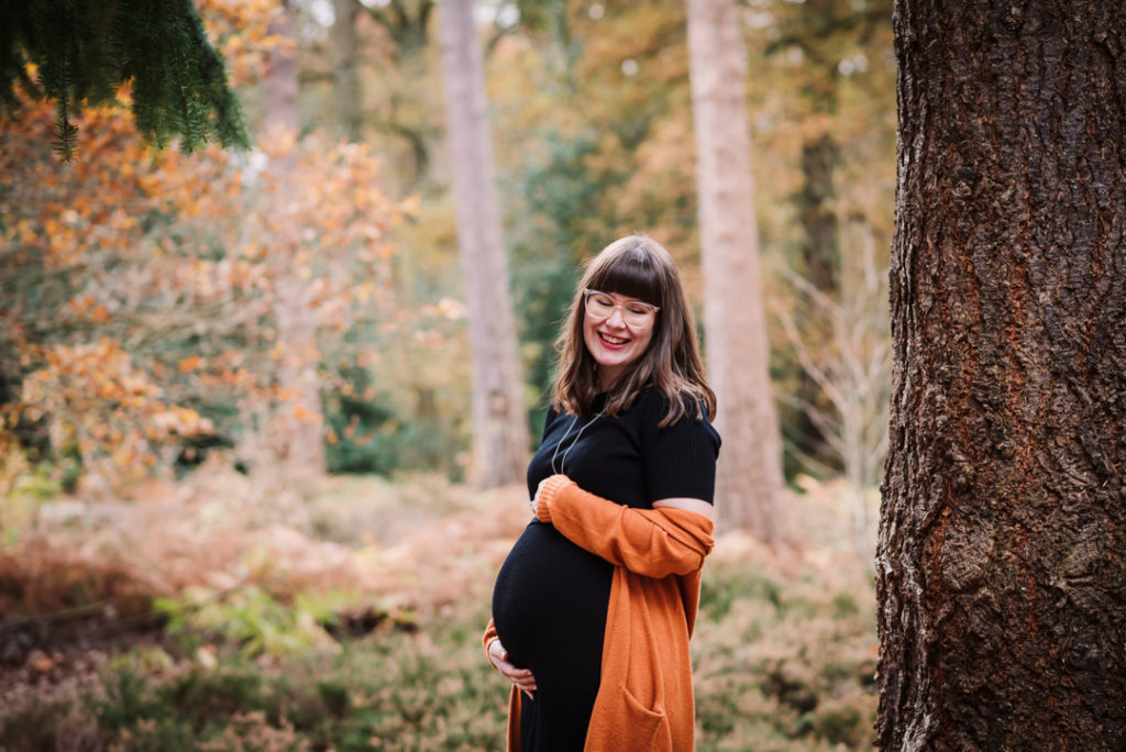 Hertfordshire woods provide an autumn backdrop for maternity photography