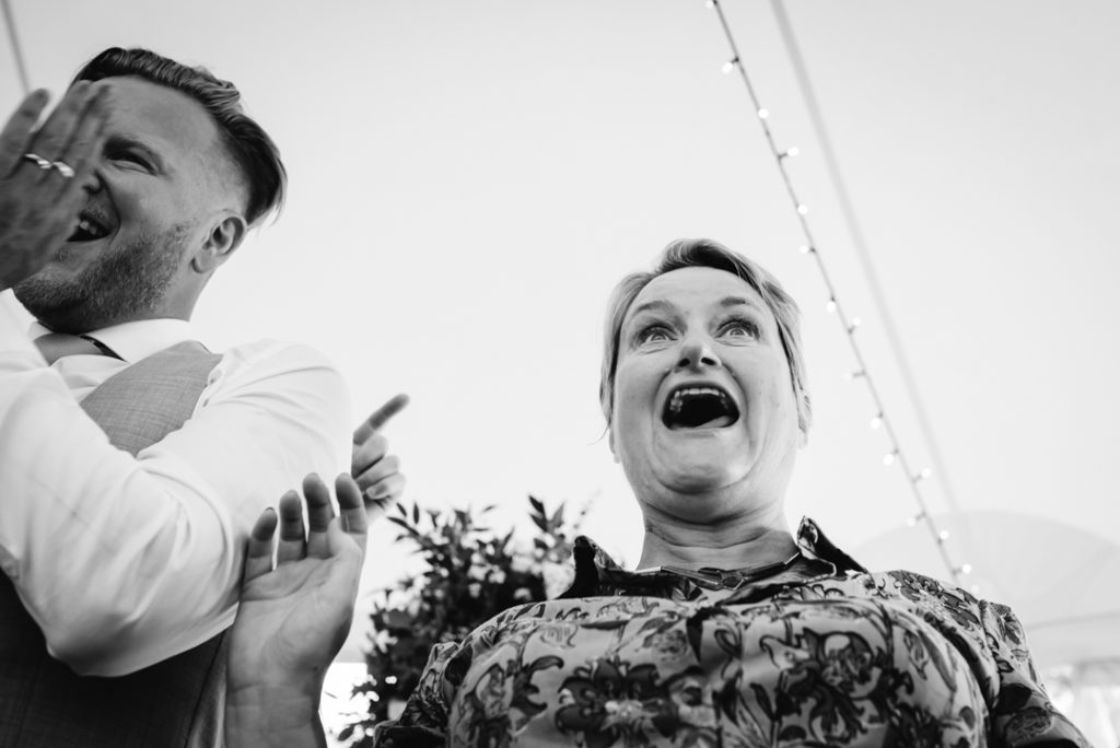 Same sex wedding photographer captures guests singing to the cabaret