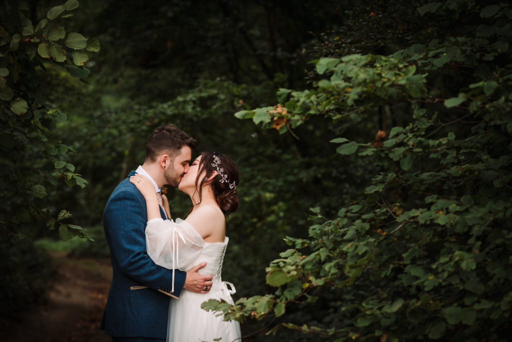 bride and groom kiss after their luton hoo wedding