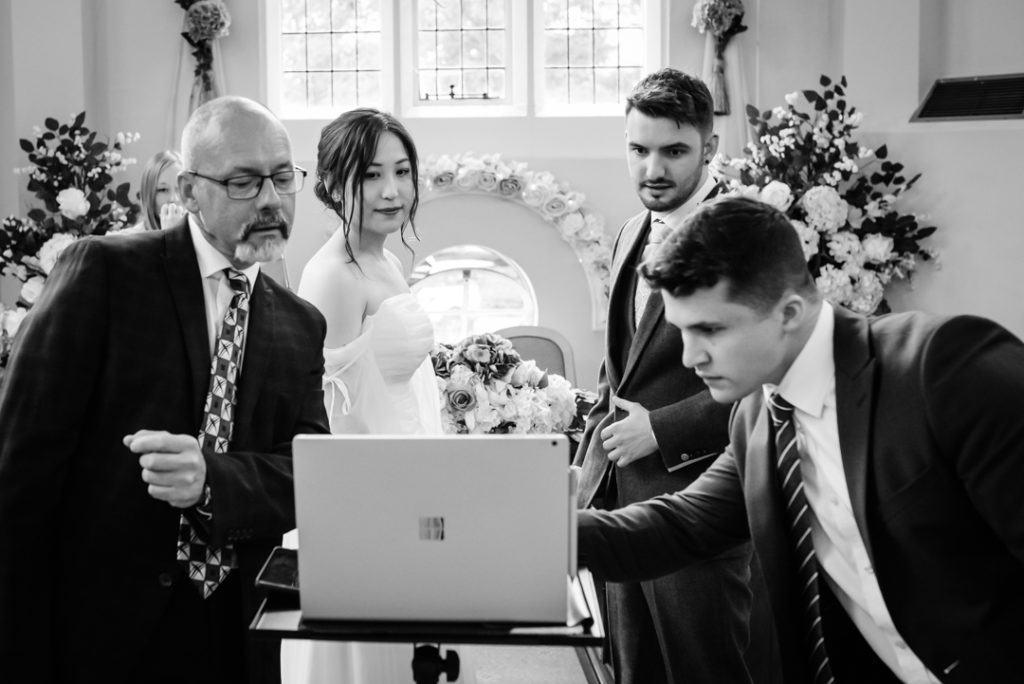 Brides family set up the live stream before the luton hoo wedding ceremony