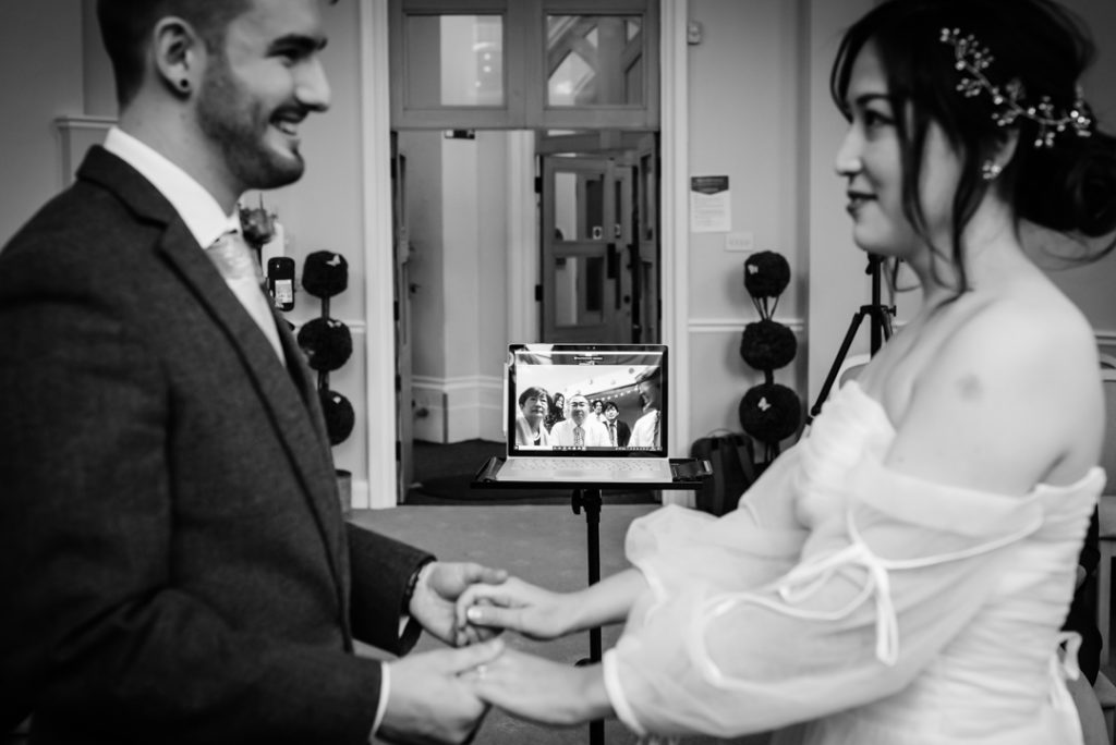 bride and groom exchange vows at their luton hoo wedding