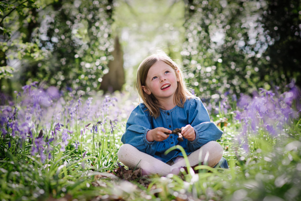 bluebells set the back ground for family photo shoot in hertfordshire