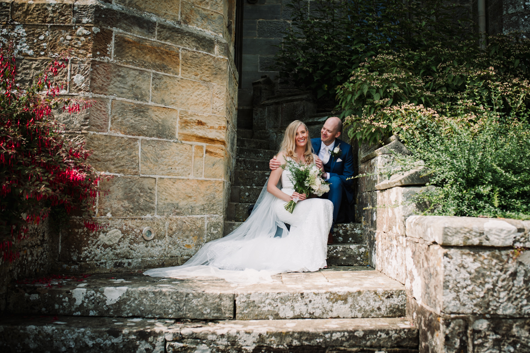 Wadhurst Castle Wedding Photography with bride and groom on the main steps