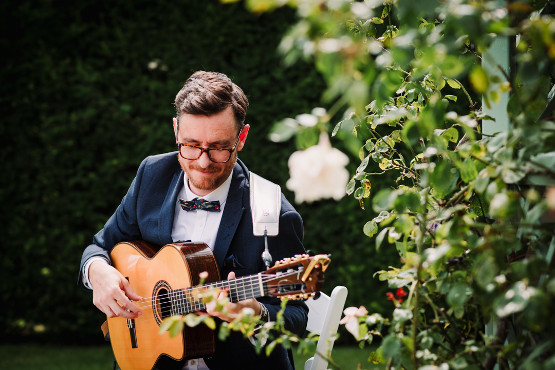 acoustic guitar plays at Wadhurst Castle Wedding