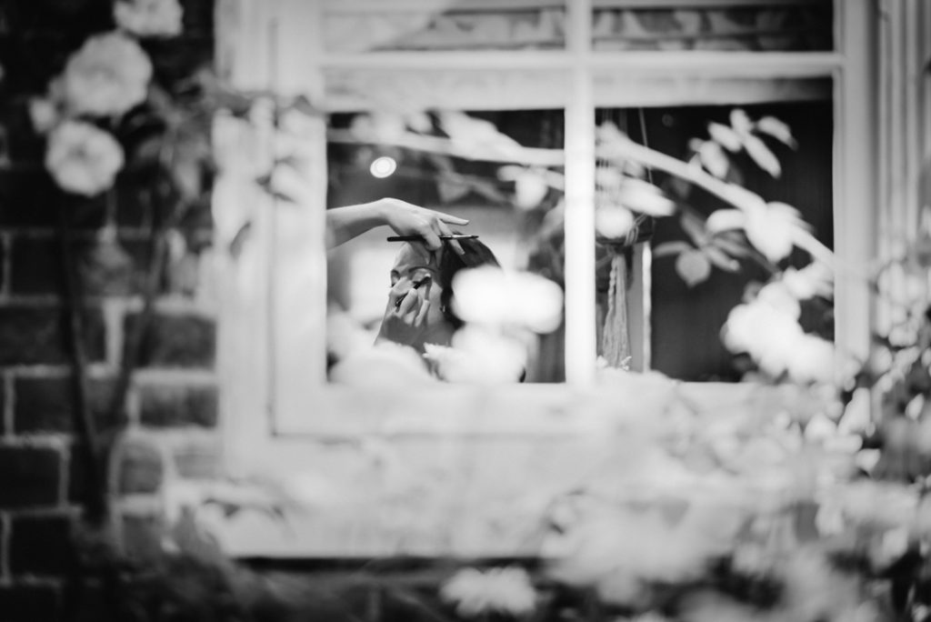 photography through a window at gaynes park wedding