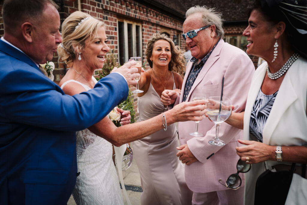 Guests and couple say cheers after the Coltsfoot Country Retreat wedding ceremony