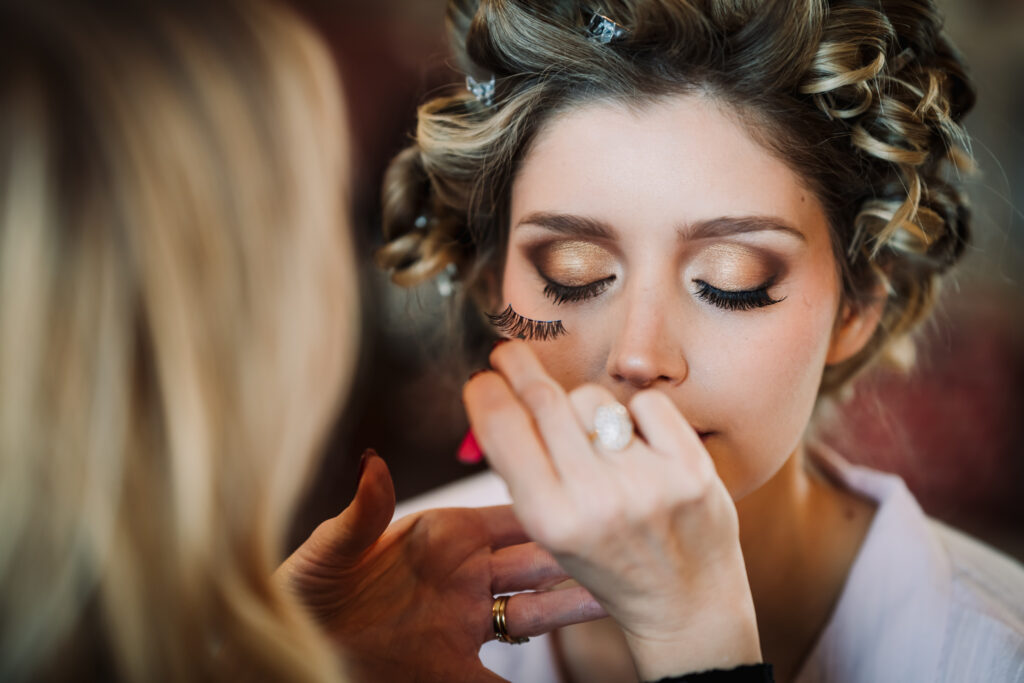 close up of bride getting her make up done before her offley place wedding