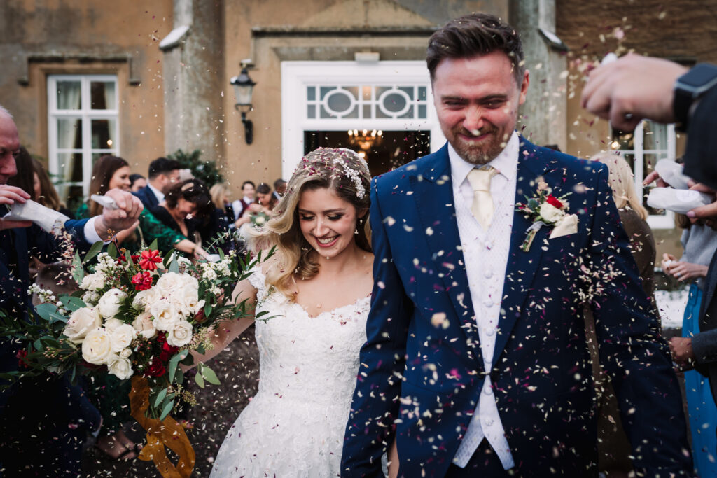 wedding photographer captures confetti shot as the bride and groom are just married at offley place in hitchin