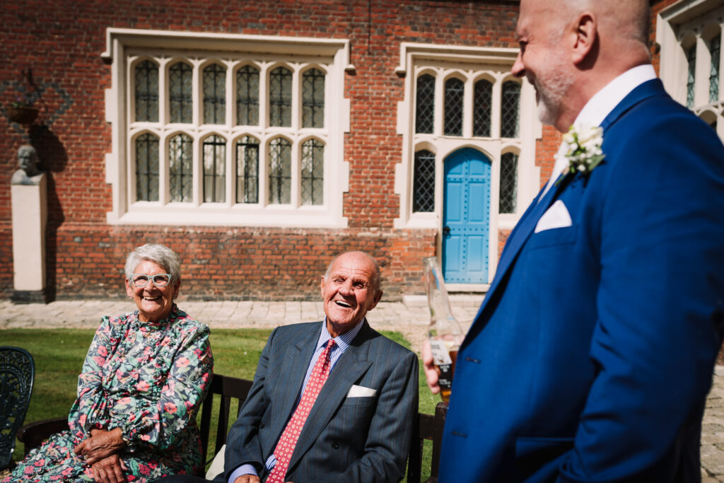Grandparents enjoy the sunshine at Gosfield Hall wedding
