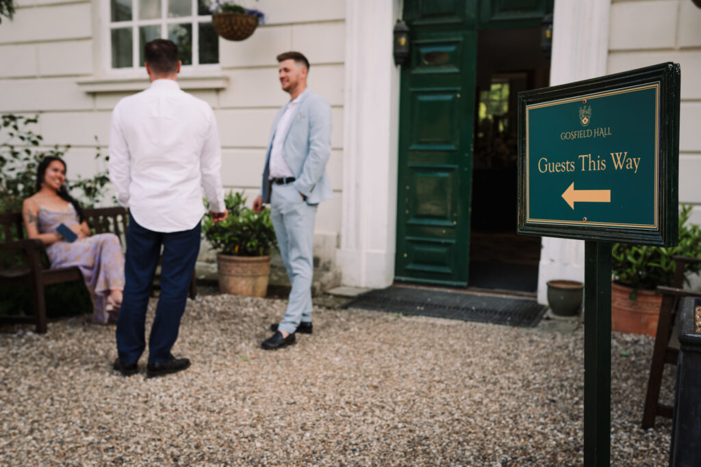 Gosfield Hall signage points towards wedding guests having a smoke