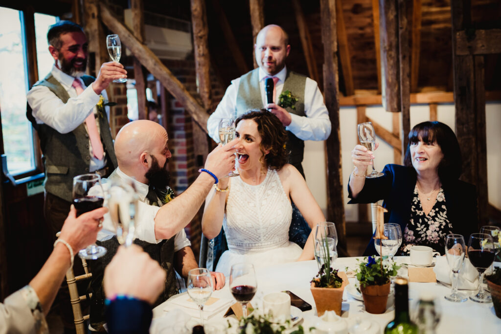 Tewin Bury Farm wedding photographer captures the best men and bride and groom reactions to the speeches