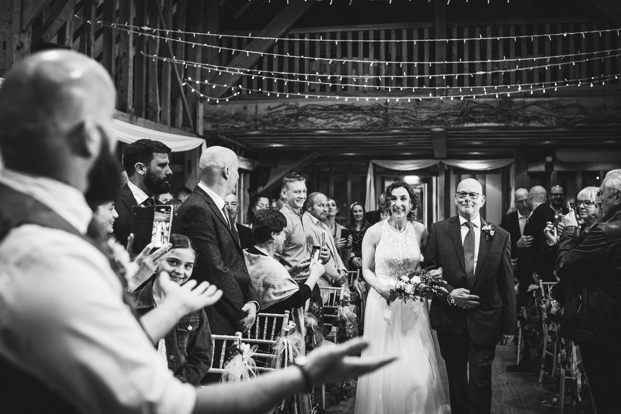 Brides arrival documented in black and white at Hertfordshire wedding ceremony