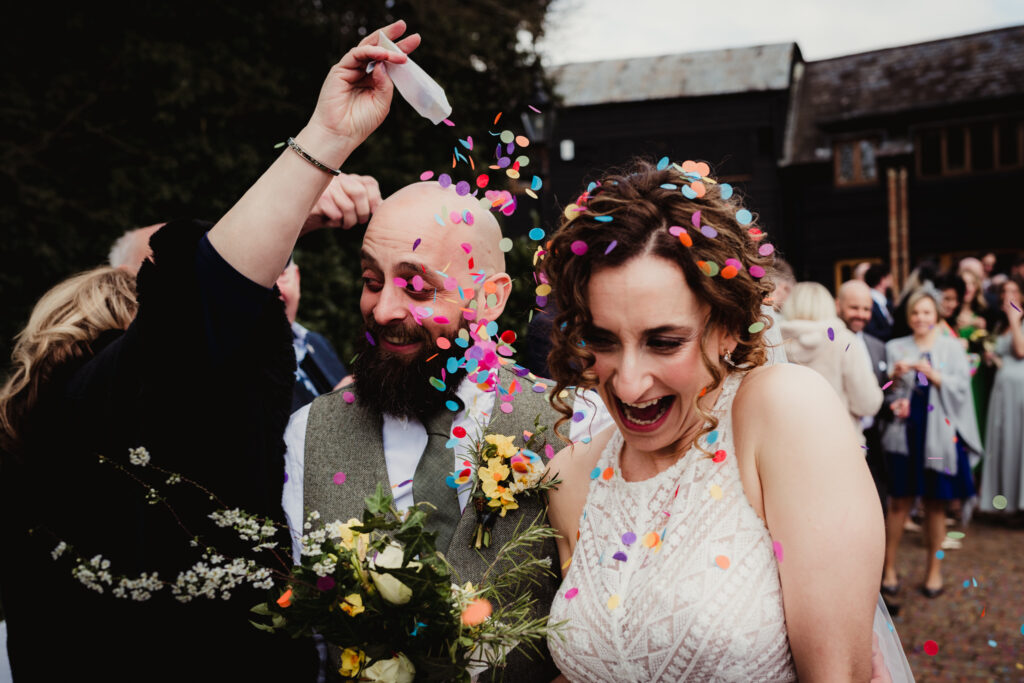 Hertfordshire wedding photographer captures confetti throw at Tewin Bury Farm