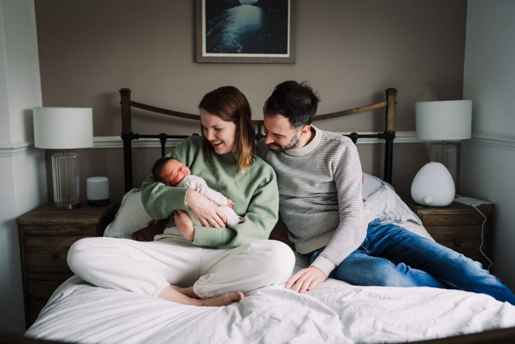 Natural newborn photography at home that includes the family dog too