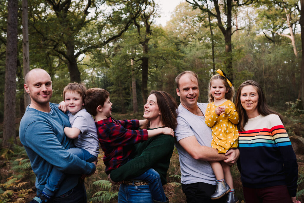 Extended family have fun together during their family photography shoot in Hertfordshire