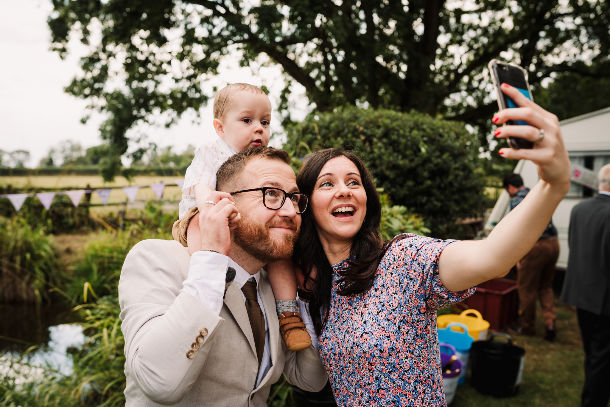 guests photograph themselves during hertfordshire garden party wedding reception