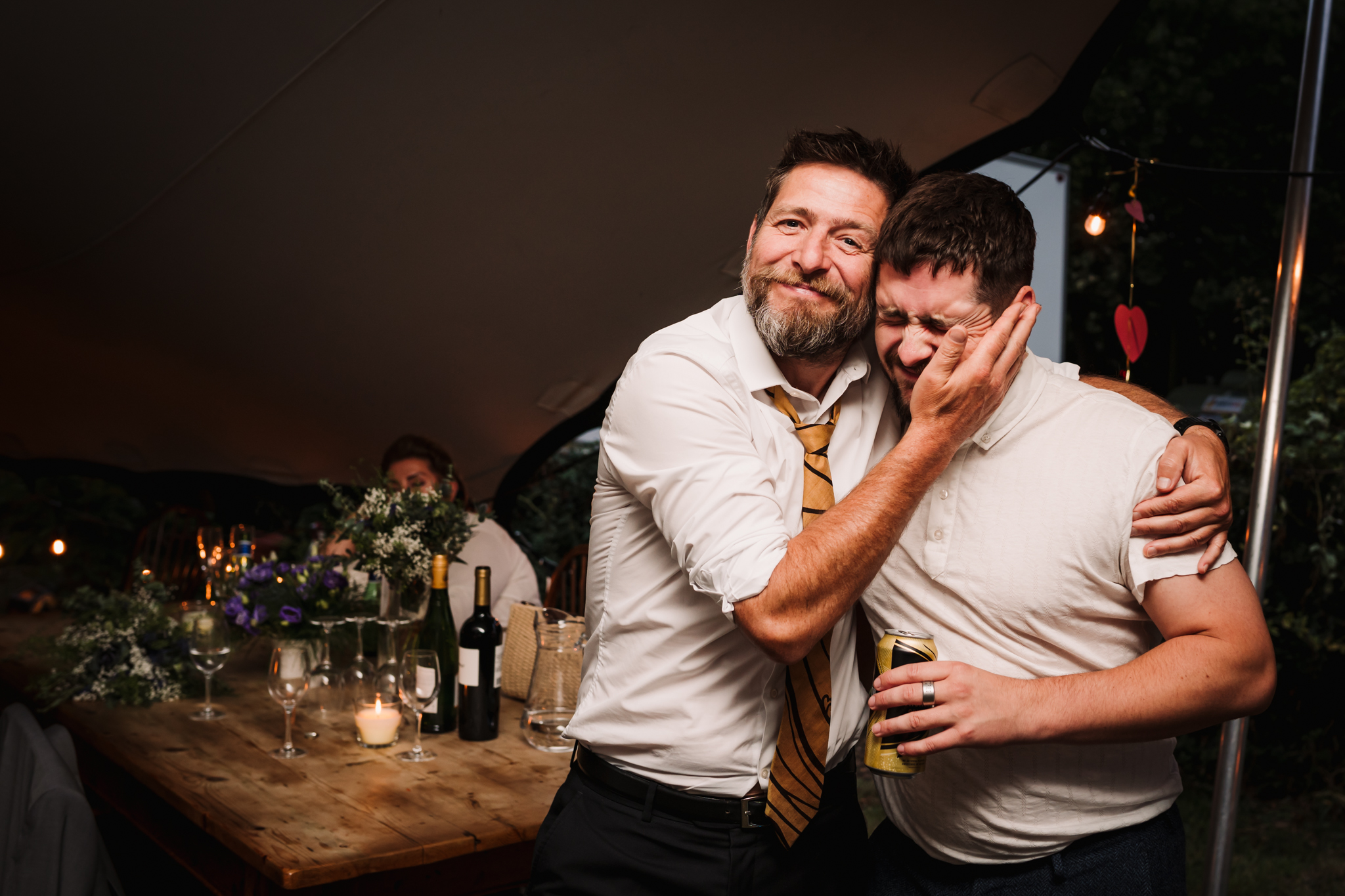 drunk guests hug at Hertfordshire Garden Party wedding 