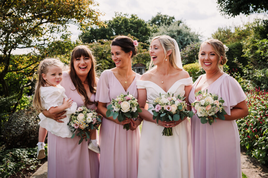 Hertfordshire Wedding Photographer at Micklefield Hall captures bridesmaids laughing together