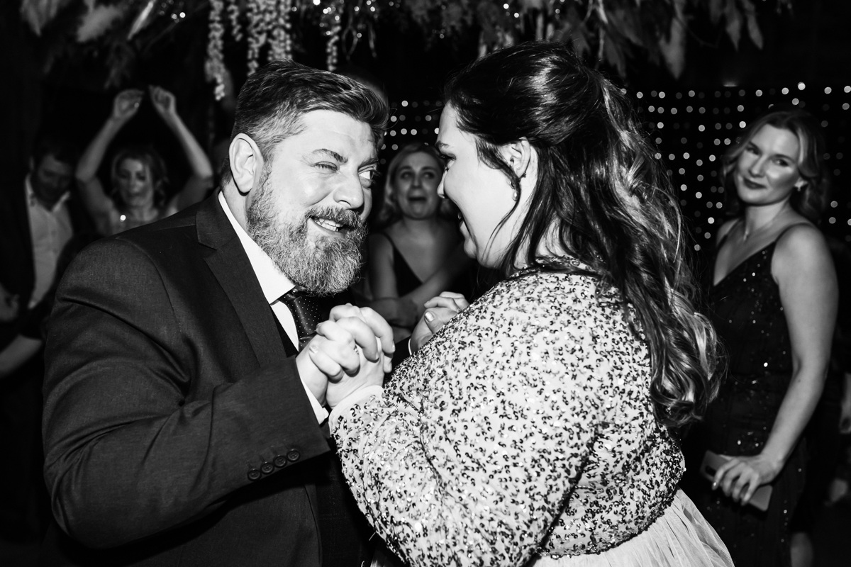 Best man and bridesmaid dance together at Hitchin wedding