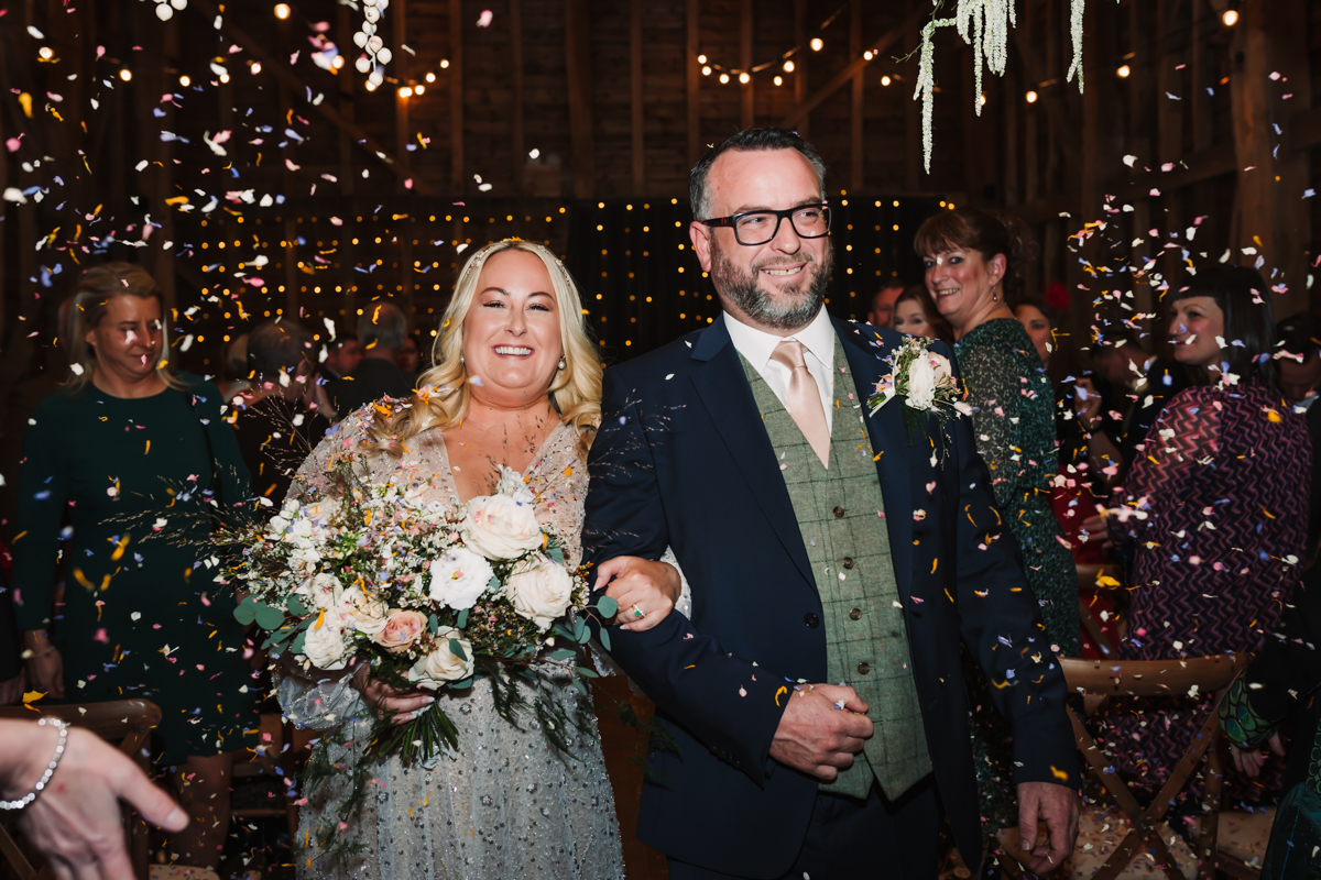 Bride and groom celebrate their Redcoats Farm wedding with a confetti throw