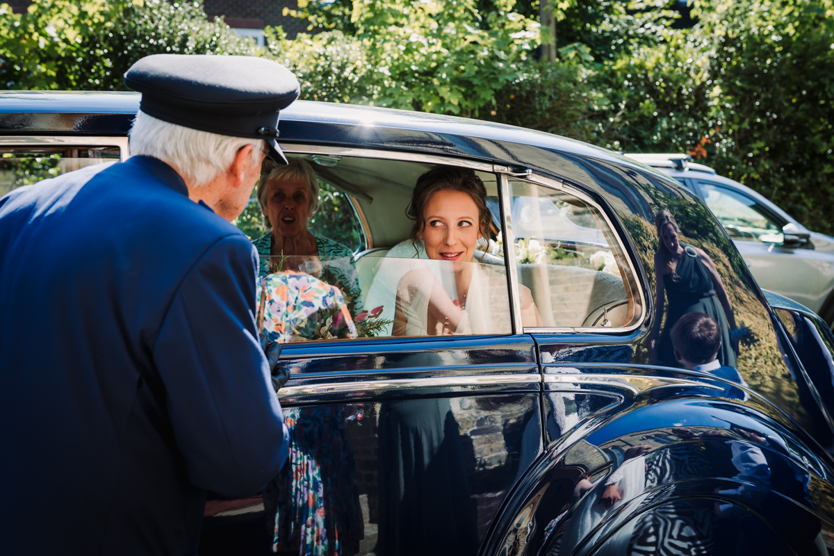 Bride arrives in style for her Rowley Barn wedding