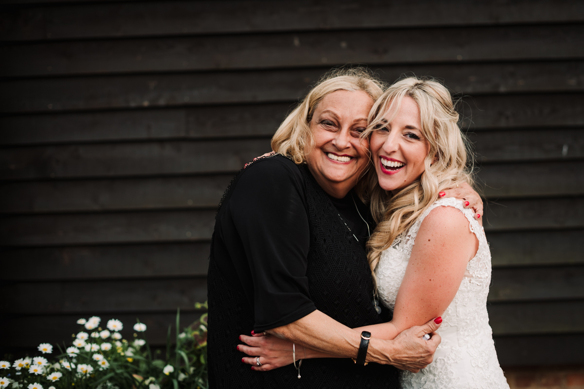 Bride cuddles her aunt at Hertfordshire wedding