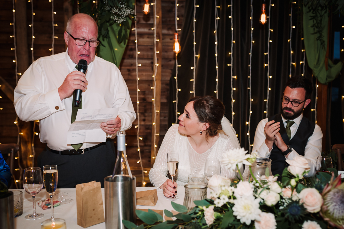 father of the bride sheds a tear during his speech at redcoats Farm wedding reception