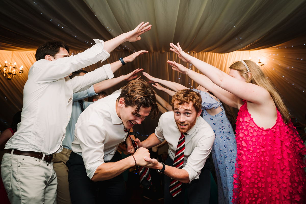 Wedding revellers dance during the festival wedding reception