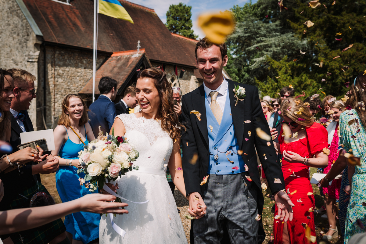Confetti is thrown after the wedding ceremony in Hertfordshire