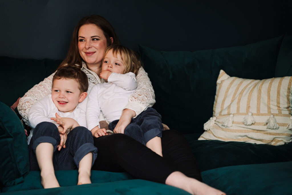 Mum and sons snuggle together during their photography session at home