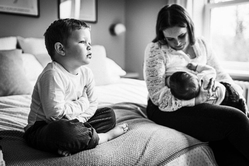 Hertfordshire family take a break from their photography at home to feed the baby