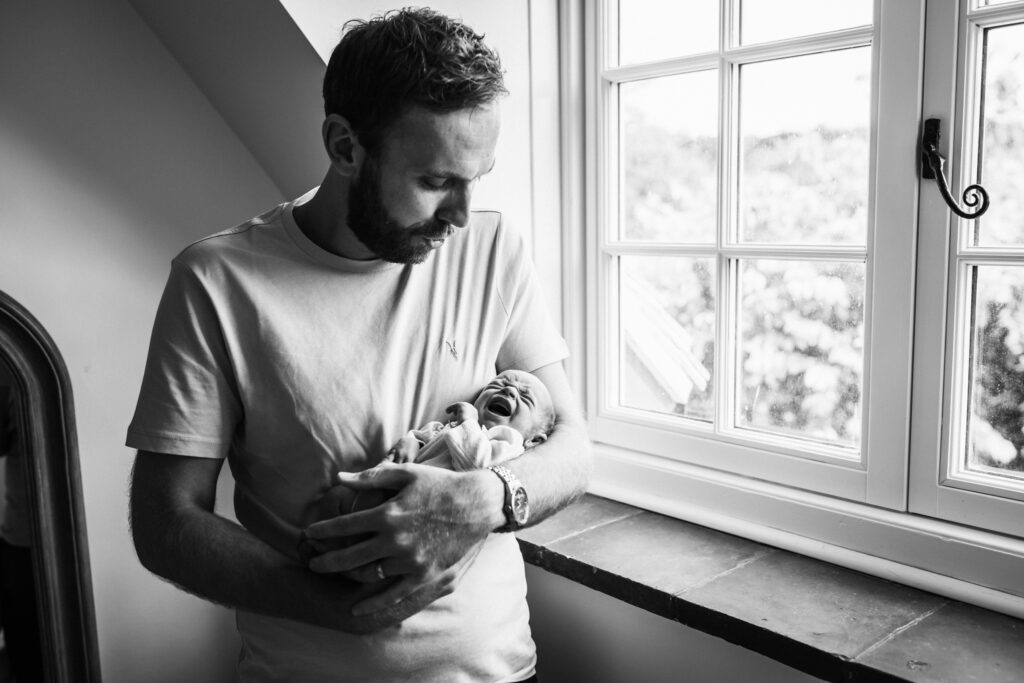 newborn photographer captures a moment of reality at home in hitchin