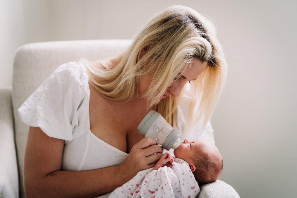 new mum feeds her baby at home in hitchin