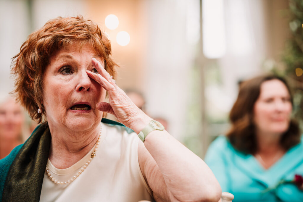 mother of the bride shows emotion during wedding speeches in Hertfordshire